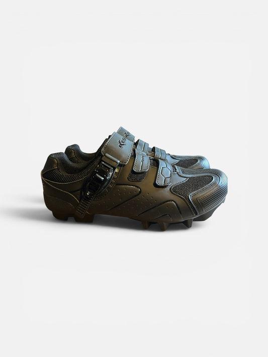 Carly's Boutique & More all-black mountain bike shoes with mesh panels, buckle closure, and high-traction outsole.